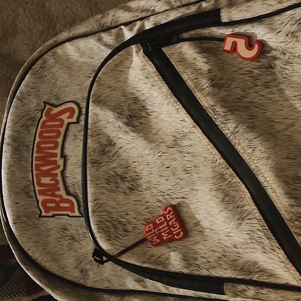 BACKWOODS White and black fur book bag